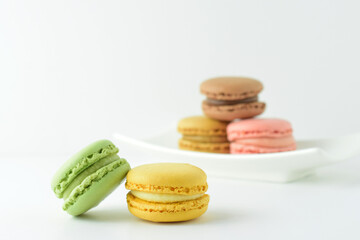 Colorful, sweet macarons, on a white background, typical French.