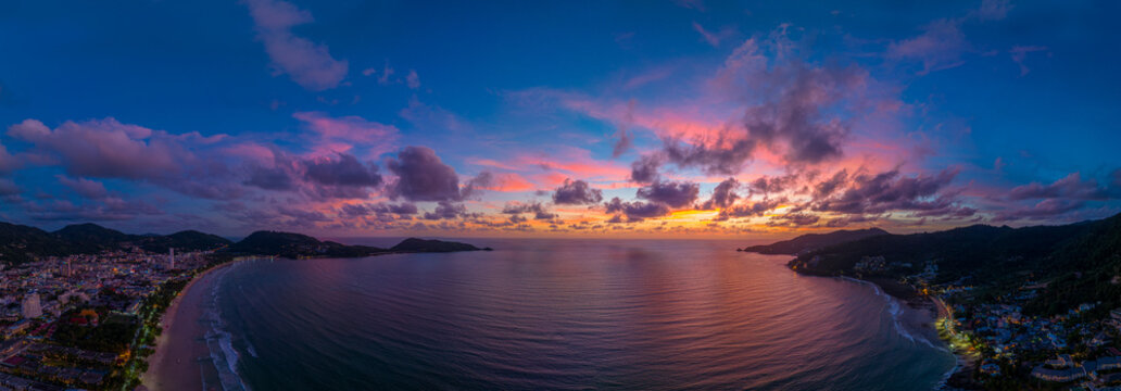 Aerial panorama view scene romantic pink sky on sunset at Patong beach. .abstract nature background..Sunset with bright red light rays and other atmospheric effects. .abstract nature background.