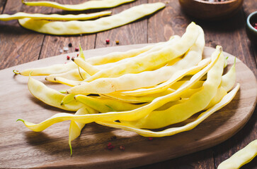Yellow Wax Beans Ready to Cook, Fresh Long Beans on Wooden Background