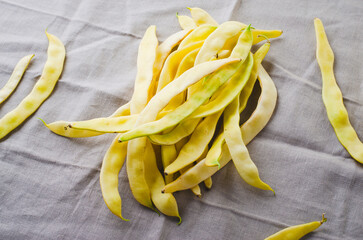 Yellow Wax Beans Ready to Cook, Fresh Long Beans on Beige Background