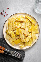 Cooked Yellow Beans, Long Beans in a Plate over Light Grey Background, Tasty Vegetarian Meal