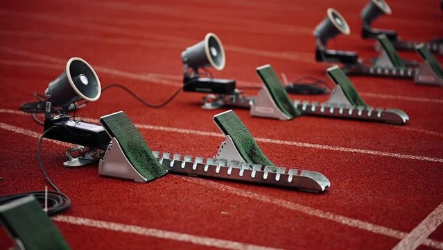 Close-up of Starting Blocks on Orange Running Track