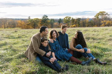 Happy family with teenage children laughing together