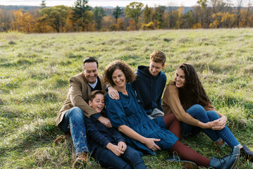 Happy family with teenage children laughing together