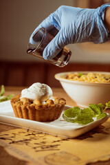 apple pie with vanilla ice cream and chocolate dripping from top