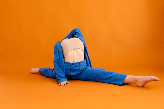 Flexible woman practicing front split