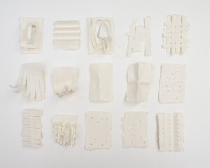 Paper swatches made by folding, weaving, tearing and cutting 