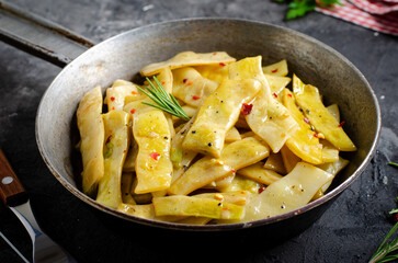 Cooked Yellow Beans, Long Beans in a Skiller over Dark Background, Tasty Vegetarian Meal