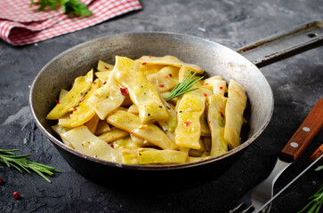 Cooked Yellow Beans, Long Beans in a Skiller over Dark Background, Tasty Vegetarian Meal