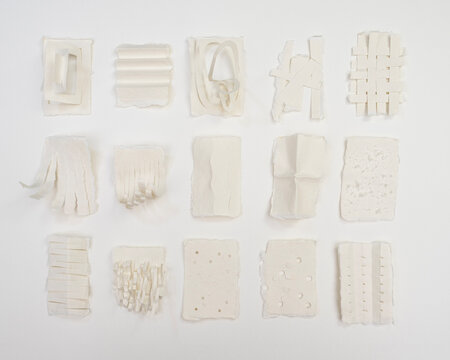 Paper swatches made by folding, weaving, tearing and cutting 