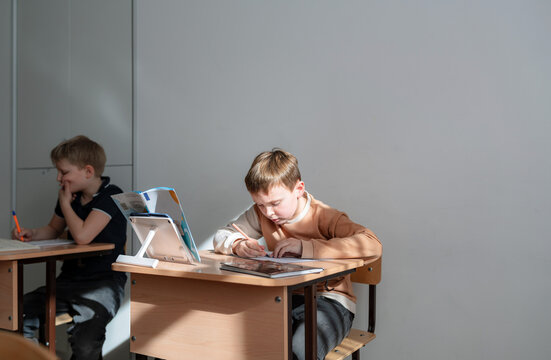 new student in a classroom sitting at a desk