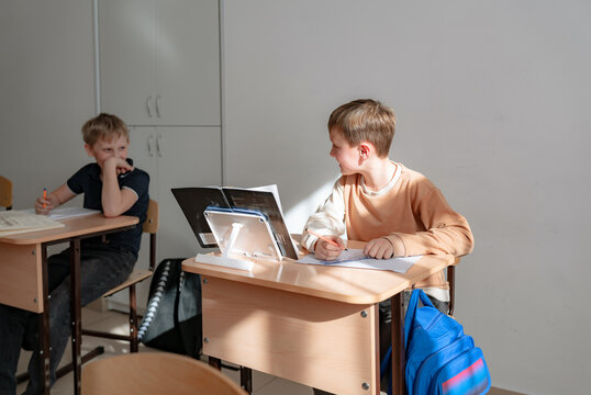 School Students Talking In A Class Room 