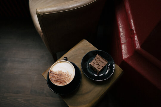 Cup of coffee with desserts on a table