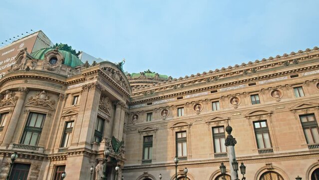 View of Italian-style opera house with library museum in Paris. Tourists enjoy the cultural gem of Palais Garnier, an architectural and historical building in Paris, France.