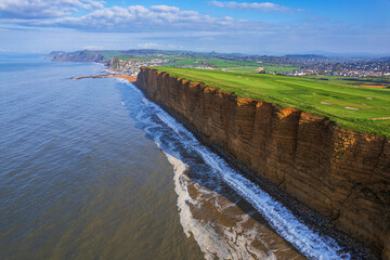 Aerial morning view of the West Bay cliffs on coastline of the Jurassic Coast, UNESCO World Heritage Site, Dorset, England