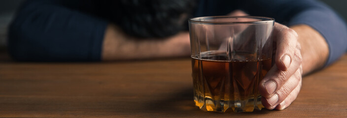 sad man hand alcohol glass