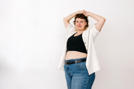 Positive plump non binary person in black binder