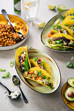 Overhead healthy vegetarian tacos on a plate with ingredients