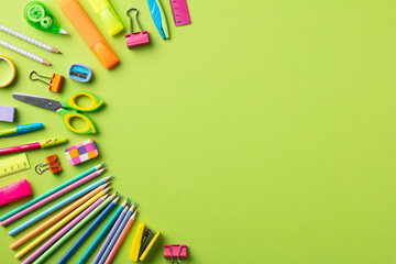 Frame of school supplies on color background. Back to school concept. Flat lay, top view.