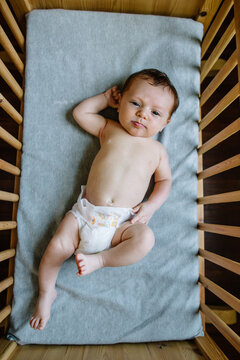 Overhead view of baby in bassinet