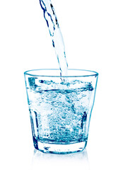 pouring water on a glass on white background