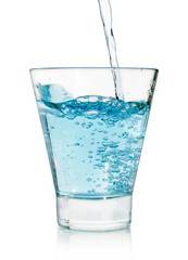 pouring water on a glass on white background