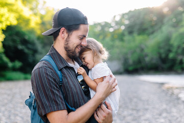 Dad give young daughter affection