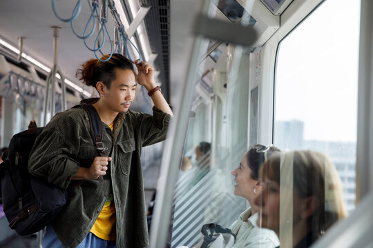 Man and women traveling in a metro