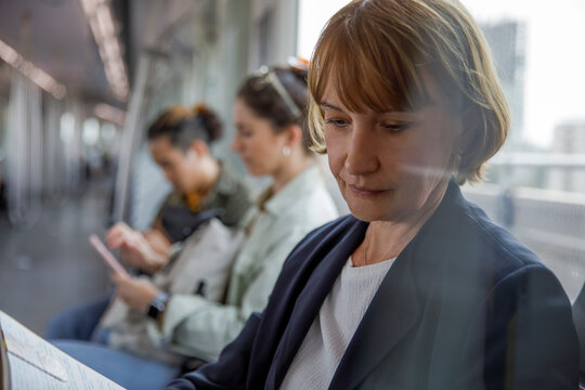 Serious businesswoman traveling in a metro train