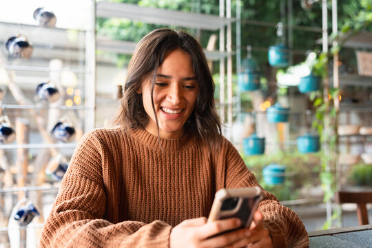 Hispanic Woman Using Her Cellphone