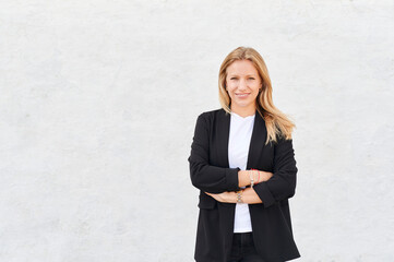 Young businesswoman smiling outdoors