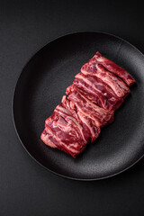 Fresh raw beef ribs with salt, spices and herbs