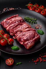 Fresh raw beef ribs with salt, spices and herbs