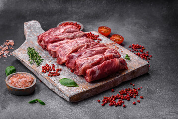 Fresh raw beef ribs with salt, spices and herbs