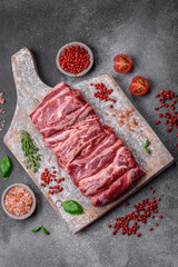 Fresh raw beef ribs with salt, spices and herbs
