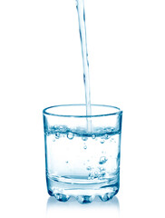 pouring water on a glass on white background