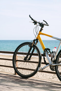 A sports bike is parked near the railing on the embankment.