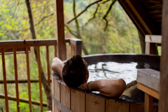 Man relaxing in a Finnish hot tub