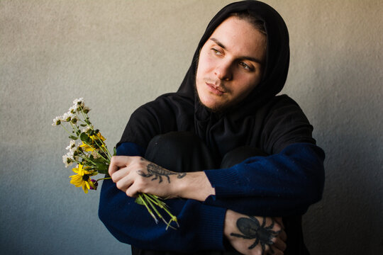 Pensive, hopeful trans muslim person