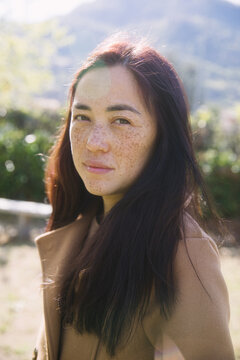 Portrait of Asian woman with freckles