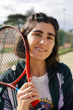 Portrait of a girl with tennis racket 