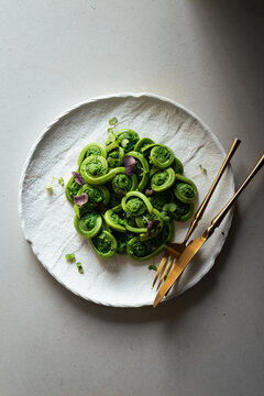 Freshly foraged and cooked wild fiddleheads.
