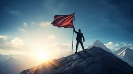 A man standing triumphantly on a mountain peak, holding a red flag - obrazy, fototapety, plakaty