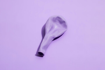 Lavender balloon on a colorful background with hard lighting