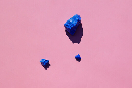 Colorful painted stones on a coloured background