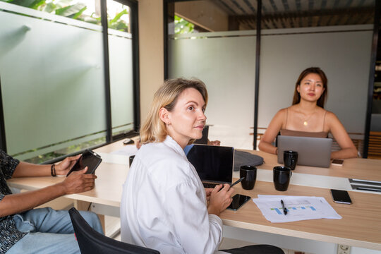 Coworkers At Business Meeting In Office