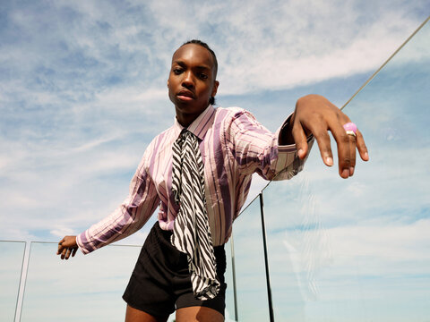 Feminine Young Black Man Genderless on the terrace