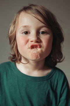 Portrait of a child showing missing teeth