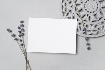 Invitation or greeting card mockup, blank card with copy space and stylish decor