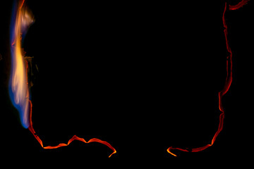 burning paper, glowing edge of paper on a black background